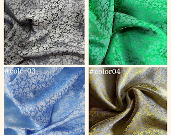 May include: Four fabric swatches with a floral pattern. The swatches are in the colors gray, green, blue, and gold.