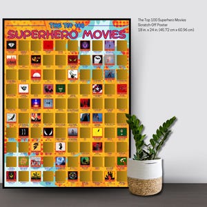 May include: A rectangular scratch-off poster titled The Top 100 Superhero Movies with a comic book style background. The poster features a grid of 100 gold foil squares, some partially scratched to reveal movie icons, measuring 18 inches by 24 inches.