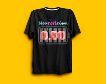May include: Black t-shirt featuring the word "Neuroticism" in a neon-style font. Below is a battery graphic displaying "0.00". The shirt is set against a yellow backdrop.