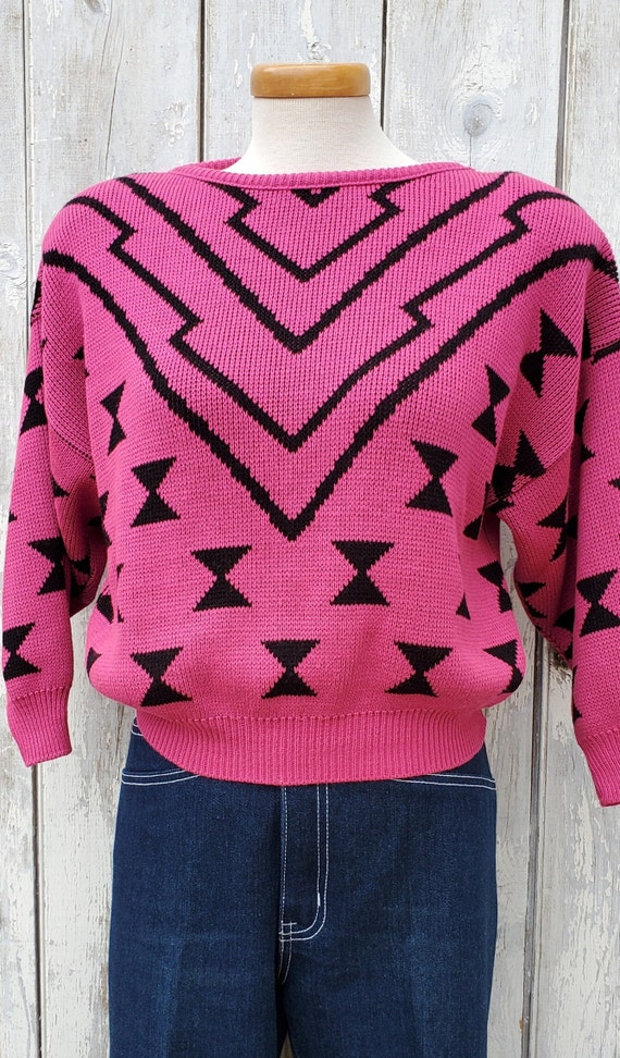 Sam's grey lightning bolt sweater on Dynasty | Rafael de la