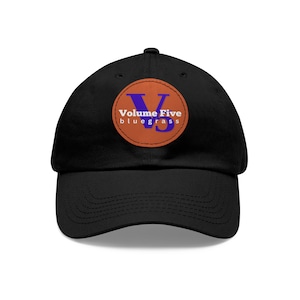 May include: Black baseball cap with a brown leather patch featuring a blue "V" and the text "Volume Five bluegrass".