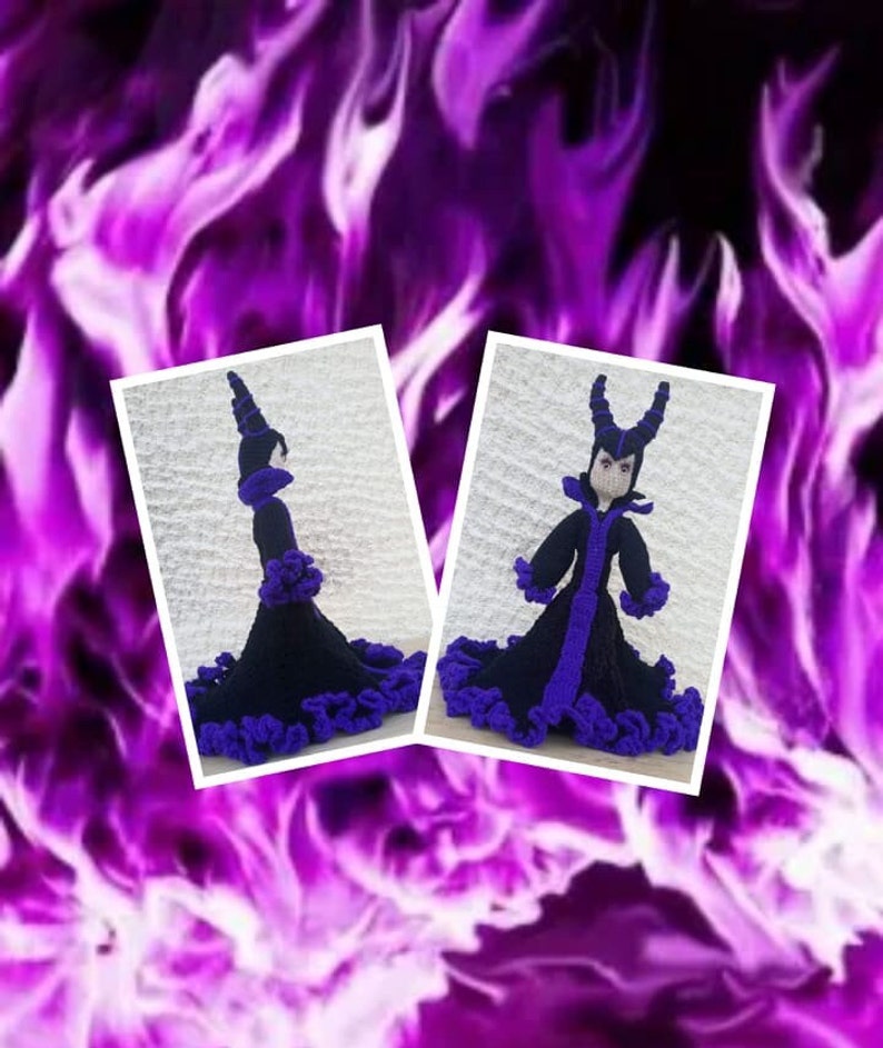 May include: A crocheted doll dressed in a black and purple gown with a pointed hat and horns. The doll is standing on a white background.