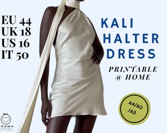 May include: A white halter dress with a long, flowing scarf. The dress is a simple, elegant design with a fitted bodice and a flowing skirt. The text "KALI HALTER DRESS PRINTABLE @ HOME A4/AO /A3" is visible in the image.