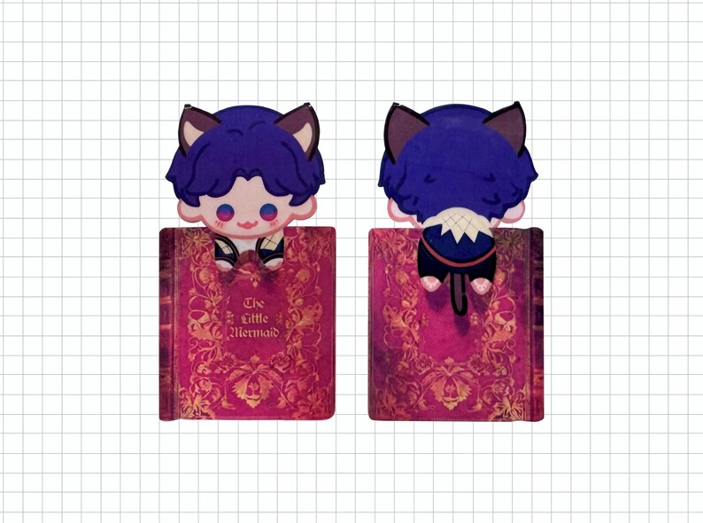 May include: A whimsical bookmark featuring a cartoon character with blue hair and cat ears, perched atop a book. The book has a pink cover with gold floral designs and the title "The Little Mermaid". The character is seen from the front and back.