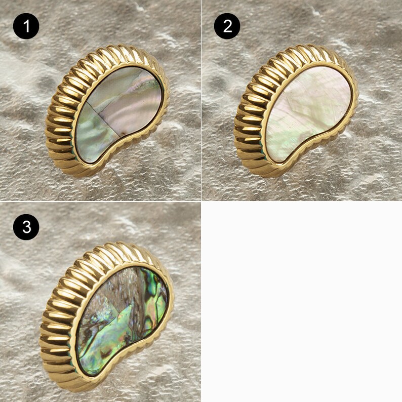 May include: Three close-up images of a gold-coloured, decorative cabinet knob with a mother-of-pearl inlay. The inlay has a unique, iridescent pattern.
