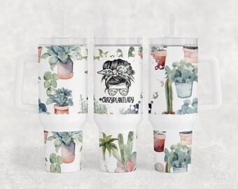 May include: Three white stainless steel tumblers with a handle and a clear lid. The tumblers are decorated with a watercolor pattern of plants and the text "#CRAZYPLANTLADY".