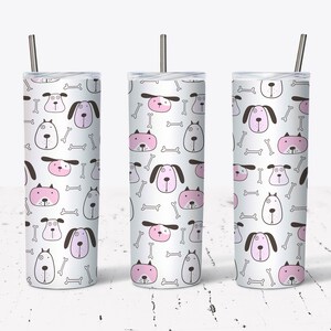 May include: Three stainless steel tumblers with a white background and a repeating pattern of pink and gray cartoon dogs and white bones.