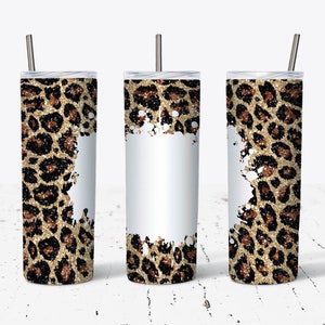 May include: Three stainless steel tumblers with lids and straws. The tumblers are decorated with a gold glitter leopard print pattern and white paint splatters.