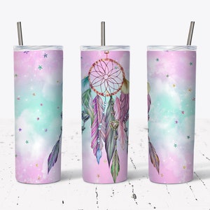May include: A stainless steel tumbler with a pink and blue ombre design featuring a dreamcatcher with feathers and stars.
