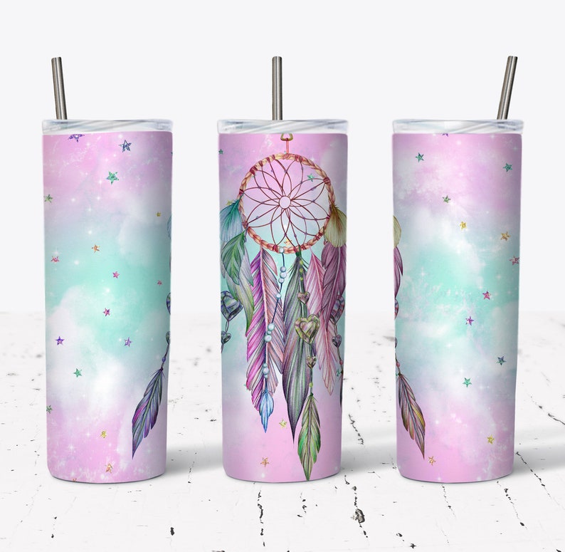 May include: A stainless steel tumbler with a pink and blue ombre design featuring a dreamcatcher with feathers and stars.