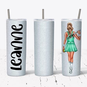 May include: Three stainless steel tumblers with a glitter finish. One tumbler has the name "Leanne" written on it. Another tumbler has a graphic of a woman playing tennis.