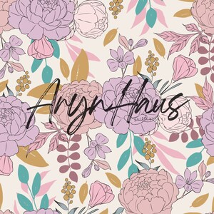 May include: A floral pattern with large peonies in pink and lilac, teal and gold accents, and the text "Aryn Haus" in a handwritten style. The design is set against a cream background.