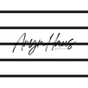 May include: Black and white graphic design with the text "Aryn Haus pattern co" in a handwritten font. The design features five horizontal black lines.