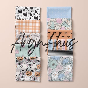 May include: An assortment of folded fabric squares with diverse patterns. Designs include black cats, orange plaid, Halloween candy, potion bottles, ghosts, pumpkins, bats, stripes, and floral prints. The text "Aryn Haus pattern co" is visible.