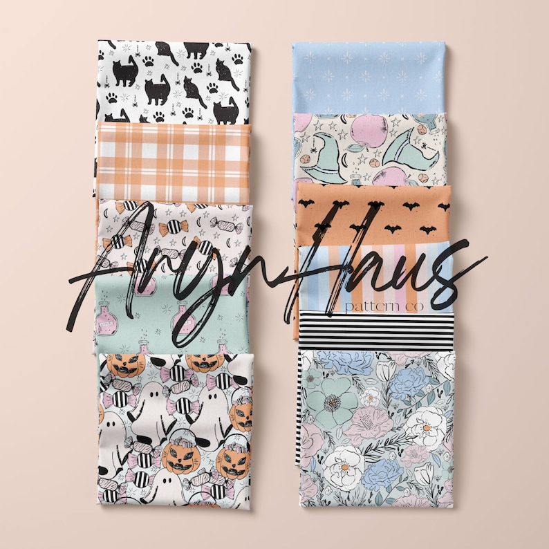 May include: An assortment of folded fabric squares with diverse patterns. Designs include black cats, orange plaid, Halloween candy, potion bottles, ghosts, pumpkins, bats, stripes, and floral prints. The text "Aryn Haus pattern co" is visible.