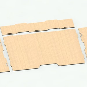 May include: Four pieces of unfinished wood, cut into rectangular shapes, with a wood grain pattern. The pieces are arranged in a way that suggests they could be assembled into a box.