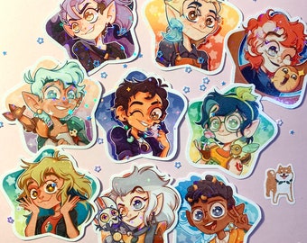 May include: A set of ten star-shaped stickers featuring characters from the animated series The Owl House. The stickers are holographic and feature various characters, including a witch with purple hair, a boy with brown hair, a girl with blonde hair, and a boy with green hair.