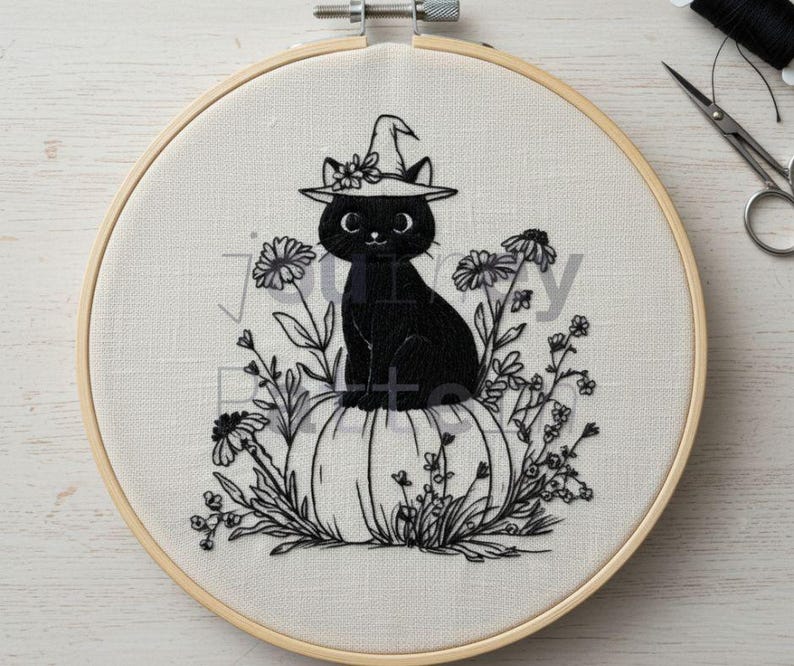May include: An embroidery hoop featuring a black cat wearing a witch hat, perched atop a pumpkin. The cat is surrounded by floral embroidery. The design is in black thread on a cream-colored fabric, perfect for Halloween decor.