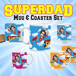 May include: A mug and coaster set featuring a superhero design. The mug is white with a blue and red superhero flying in the sky. The coaster is a brown cork material with a similar design. The mug and coaster set says "Superdad" on them.