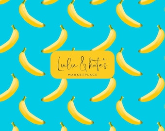 May include: A pattern of yellow bananas on a bright blue background. A yellow rectangle with the text "Lulu & Kate's MARKETPLACE" is in the center of the image. The bananas are evenly spaced and slightly curved.