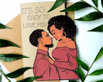 May include: A greeting card with a couple looking at each other. The card has the text "It's so easy to love you" on it.