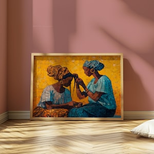 May include: Framed artwork depicting two women in blue and patterned headscarves, one braiding the other's hair. The background is yellow, and the artwork is in a wooden frame. The women are wearing blue tops and gold jewelry.