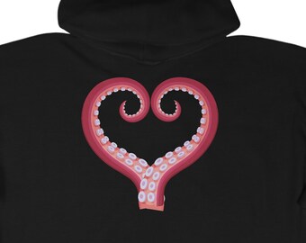 May include: Black zip-up hoodie with a heart-shaped design made from a stylized octopus tentacle. The tentacle is pink with a lighter pink interior and small white suction cups. The hoodie is made of a soft material.