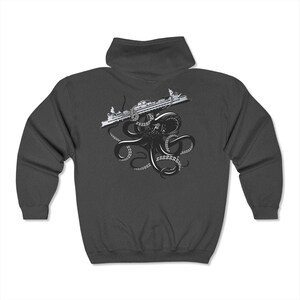 May include: Dark gray hoodie featuring a black and white graphic of an octopus with its tentacles wrapped around a cruise ship. The octopus and ship are centered on the front of the hoodie.