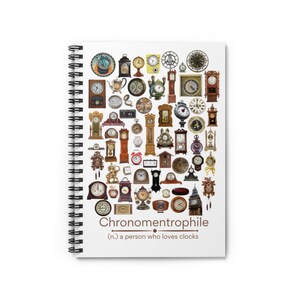 May include: A white spiral bound notebook with a colorful collage of clocks on the front cover. The text "Chronometrophille (n.) a person who loves clocks" is printed below the collage.