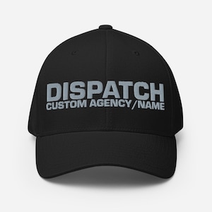 May include: Black baseball cap with the word "DISPATCH" embroidered in light gray, along with "CUSTOM AGENCY/NAME" below it. The cap has a curved brim and a structured fit, suitable for various head sizes.