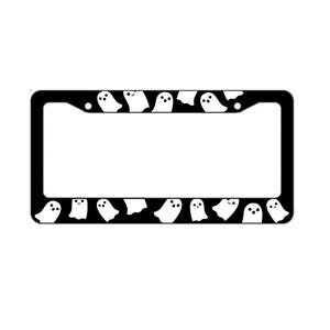 May include: Black license plate frame with a white rectangular aperture. The frame features a repeating pattern of white cartoon ghosts with black eyes and mouths, set against a black background.