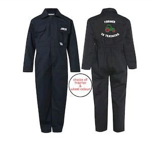 May include: Navy blue coverall with the name "JACK" embroidered on the chest. The back of the coverall features the text "FARMER IN TRAINING" above a green tractor graphic. The image also includes a circular graphic with the text "choice of tractor & wheel colour".