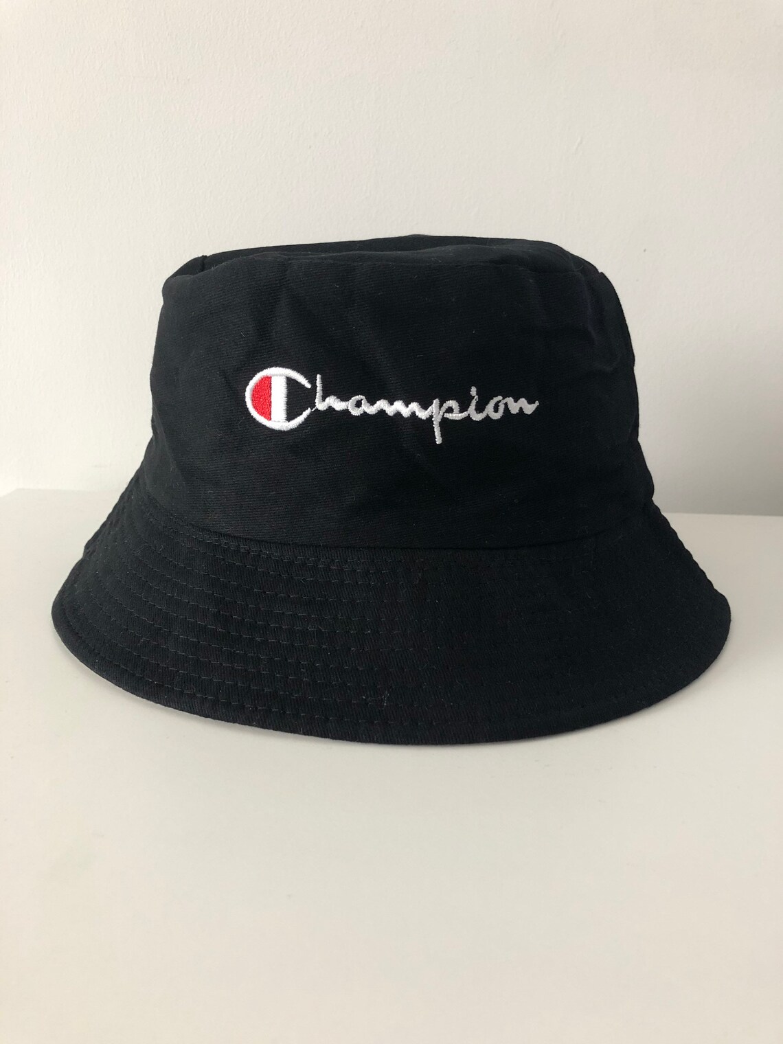 Reversible champion black and beige bucket hat. Great for Etsy