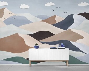 May include: A white cabinet with four doors sits in front of a wall mural depicting a stylized landscape of brown, blue, and green mountains.