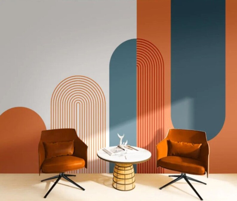 Arch and geometric wallpaper in shades of blue and orange creates a modern and stylish look for any room.