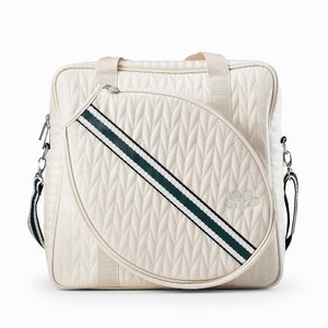 Tennis bag in quilted white vegan leather with wimbledon green webbing and solid silver metal pullers.