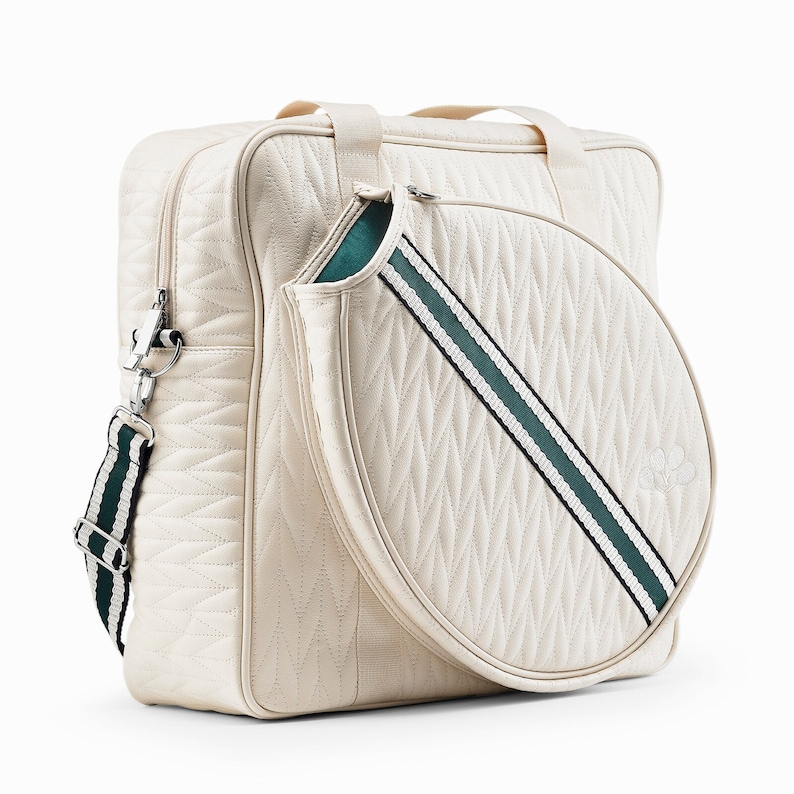 Tennis bag in quilted white vegan leather with wimbledon green webbing and solid silver metal pullers.