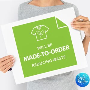 May include: A green sign with white text that reads "Will be made-to-order reducing waste". The sign features a white outline of a t-shirt with a small leaf inside.