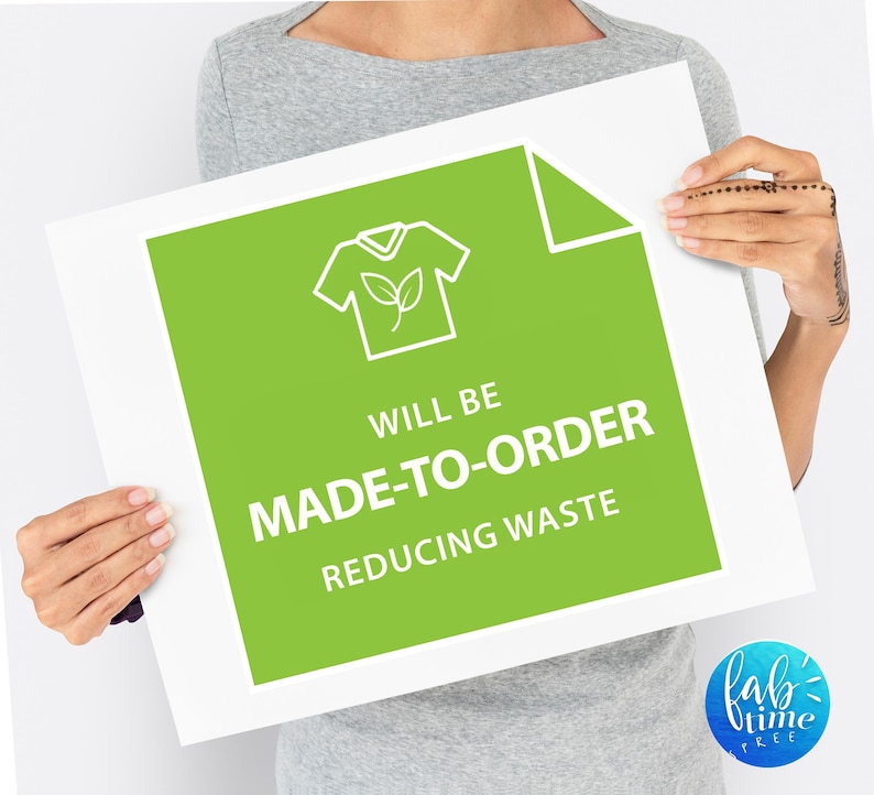 May include: A green sign with white text that reads "Will be made-to-order reducing waste". The sign features a white outline of a t-shirt with a small leaf inside.