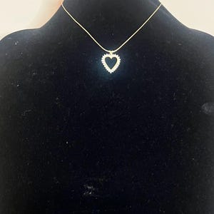 Vintage 16 inch gold tone, Monet necklace with rhinestone heart pendant