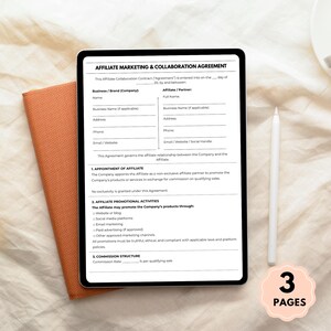May include: A digital tablet displaying an affiliate marketing and collaboration agreement. The document includes sections for business and affiliate information, promotional activities, and commission structure. A stylus and a notepad are also visible.