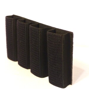 May include: Black velcro magazine pouch with four slots for holding magazines.