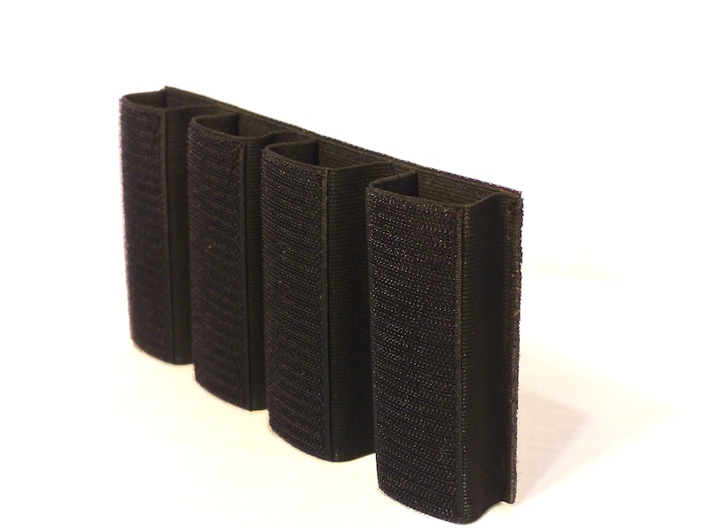 May include: Black velcro magazine pouch with four slots for holding magazines.