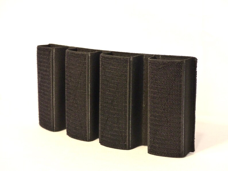 May include: Black velcro magazine pouch with four slots for holding magazines.