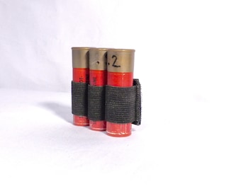 Shotgun shell holder, pouch for three shells