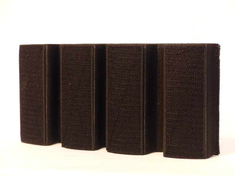 May include: Five black hook and loop fastener strips, each with a textured surface.