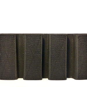 May include: Black velcro panel with five vertical slots for attaching accessories.