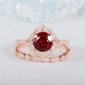 Round Cut Ruby Engagement Ring Set, Rose Gold Ruby and Diamond Halo Bridal Set, Unique Ruby and Moissanite Floral Wedding Promise Ring Set