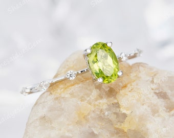 Sizes 5-10 Silver City Jewelry 10K Yellow Gold Natural Peridot Ring Oval 6x4mm Diamond Accent Sizes 5-10 Silver City Jewelry 10K Yellow Gold Natural Peridot Ring Oval 6x4mm Diamond Accent
