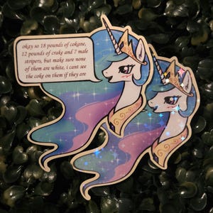 May include: A holographic sticker featuring two white unicorn characters with flowing blue, purple, and pink manes, wearing gold crowns and collars. A speech bubble contains the text: okay so 18 pounds of cokane, 12 pounds of crake and 7 male stripers, but make sure none of them are white, i cant see the coke on them if they are.